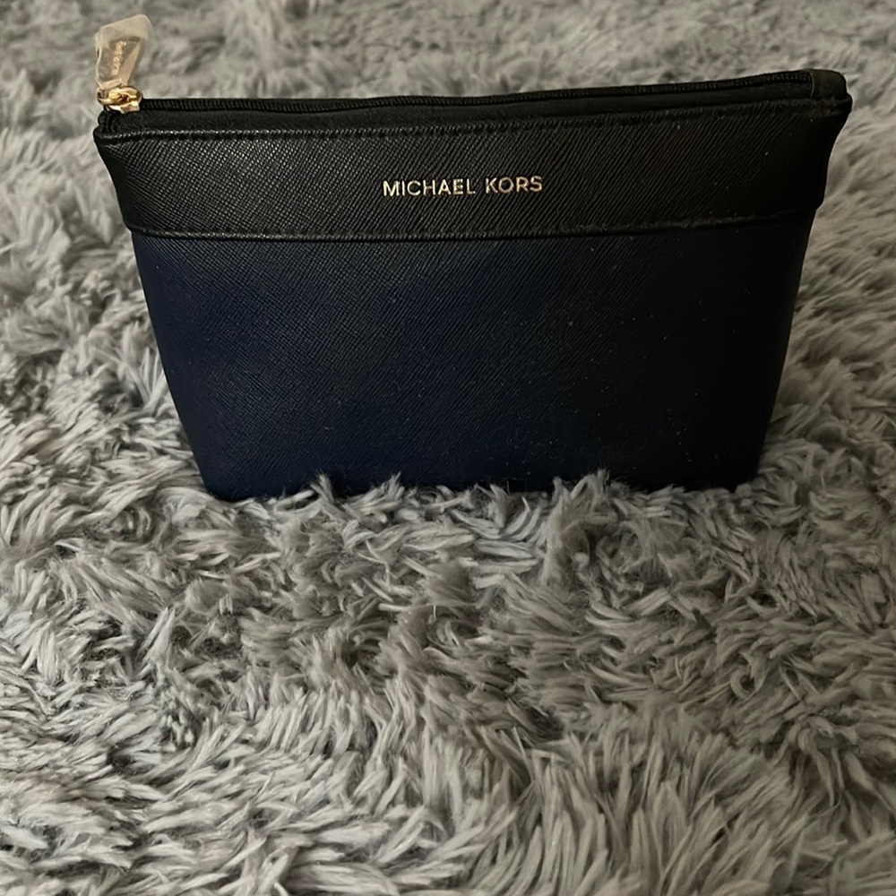 Michael Kors cosmetic bag. Black with Navy Blue. Never Used New with no tags.
